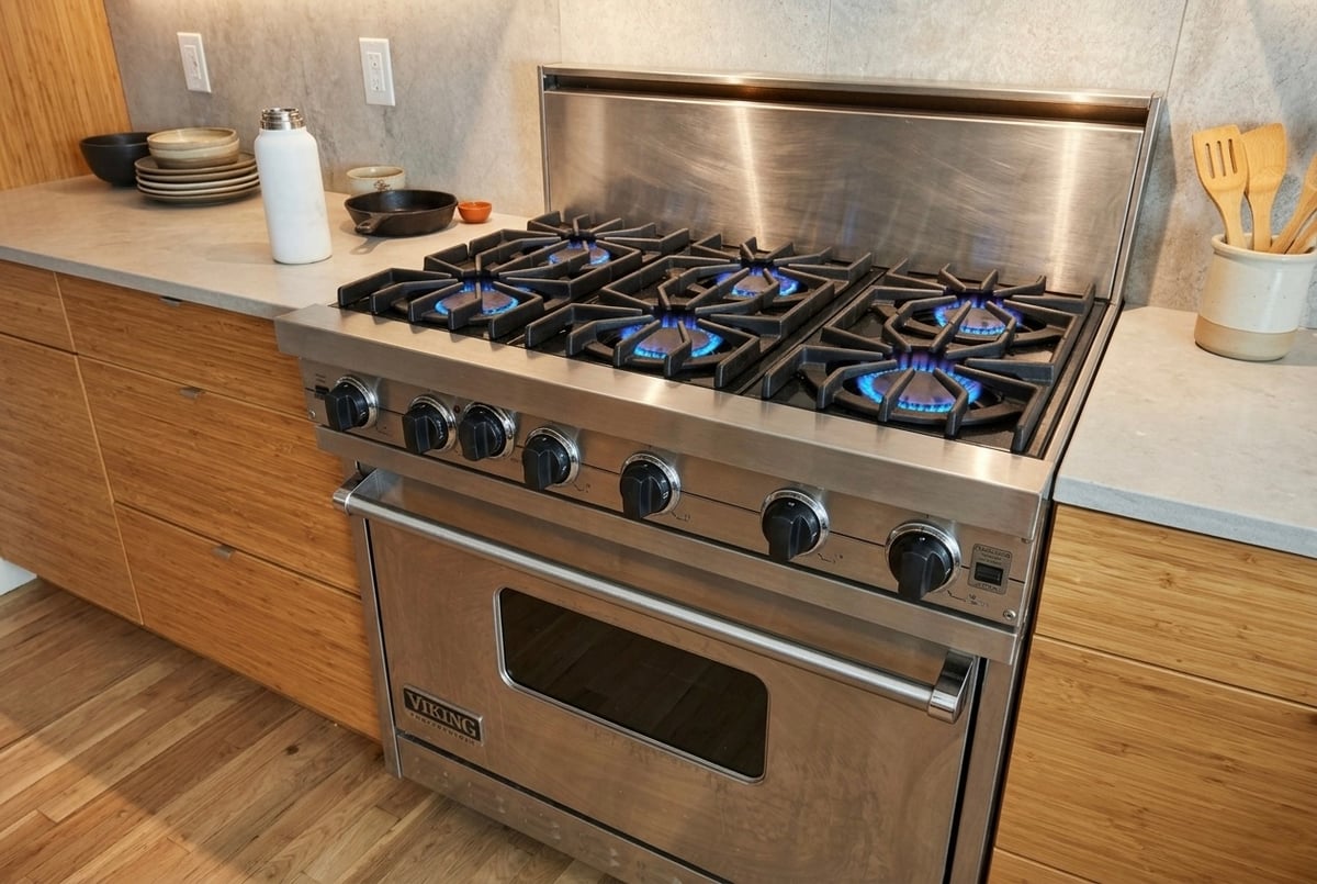 Viking burner igniter repaired — clean blue flame after OEM cap replacement